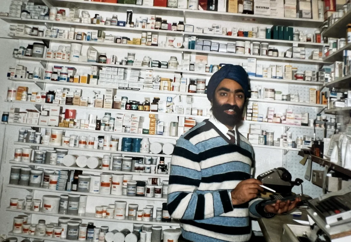 Lowmoor Pharmacy in its early years, with the founder inside the original dispensary